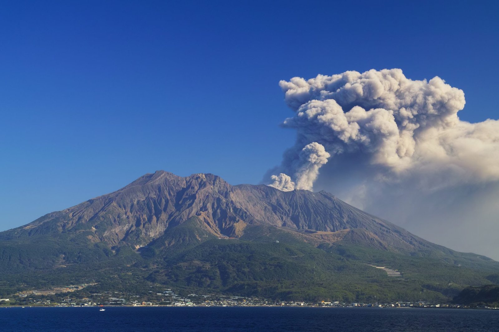 Sakurajima erupting across Kinko Bay in Kagoshima