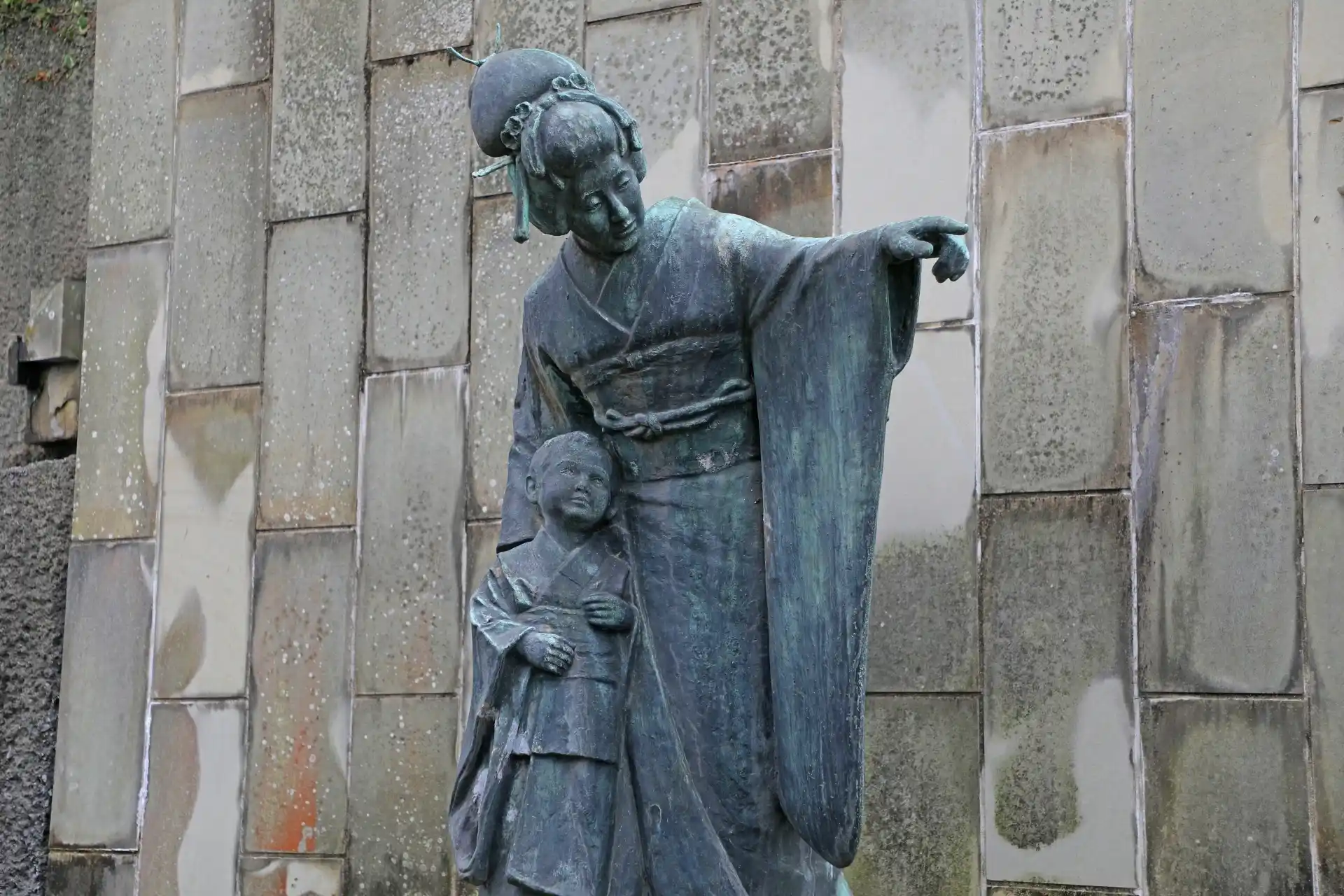 Statue of Miura Tamaki, the Japanese soprano famous for Madama Butterfly, standing in Glover Garden,