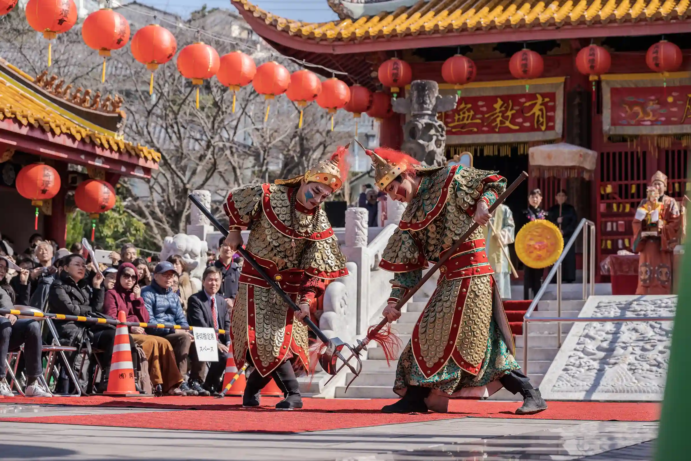 Performers in traditional Chinese costumes dancing at Confucius Shrine during the Nagasaki Lantern F