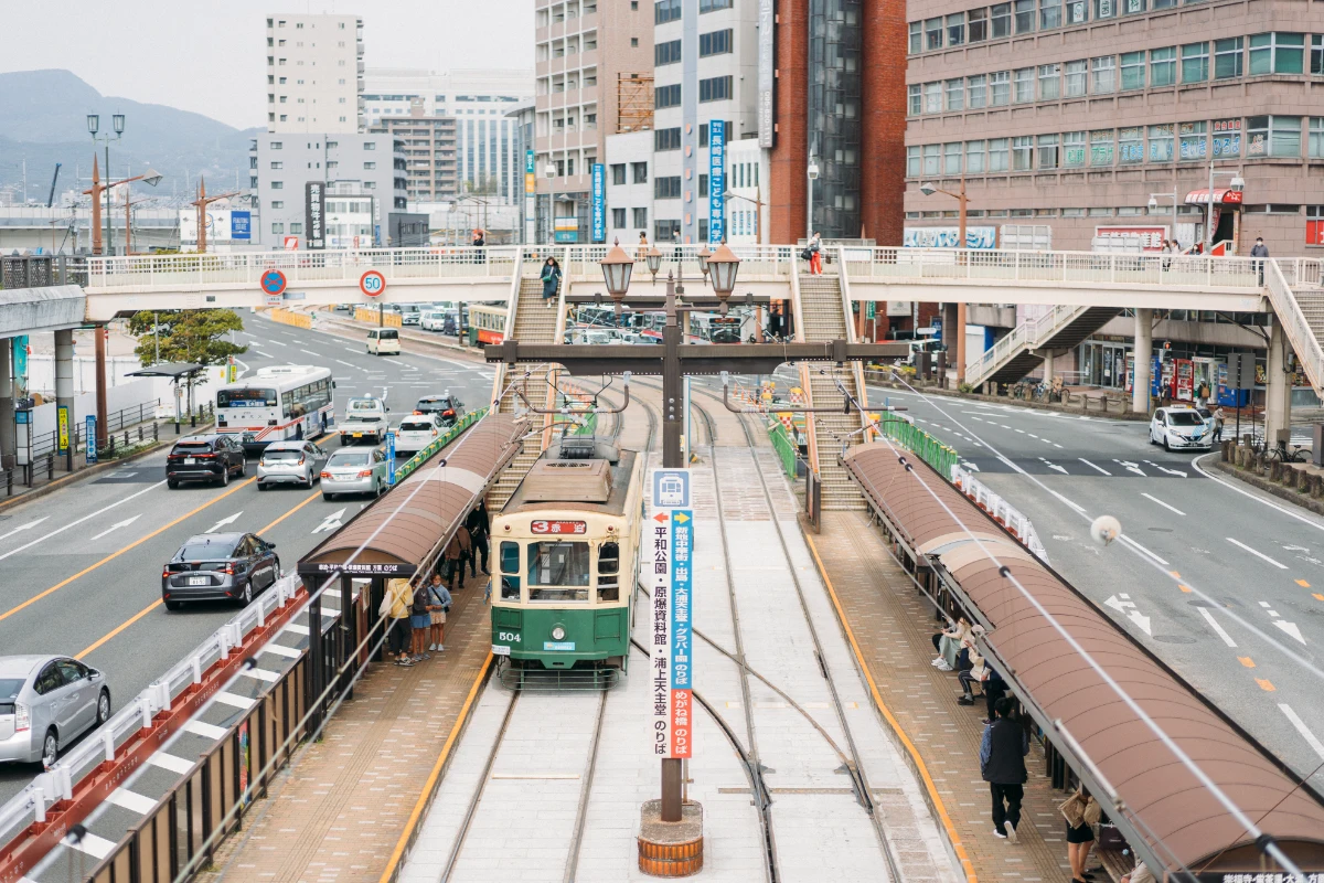 A streetcar running through Nagasaki city, a popular way to travel between major sightseeing spots