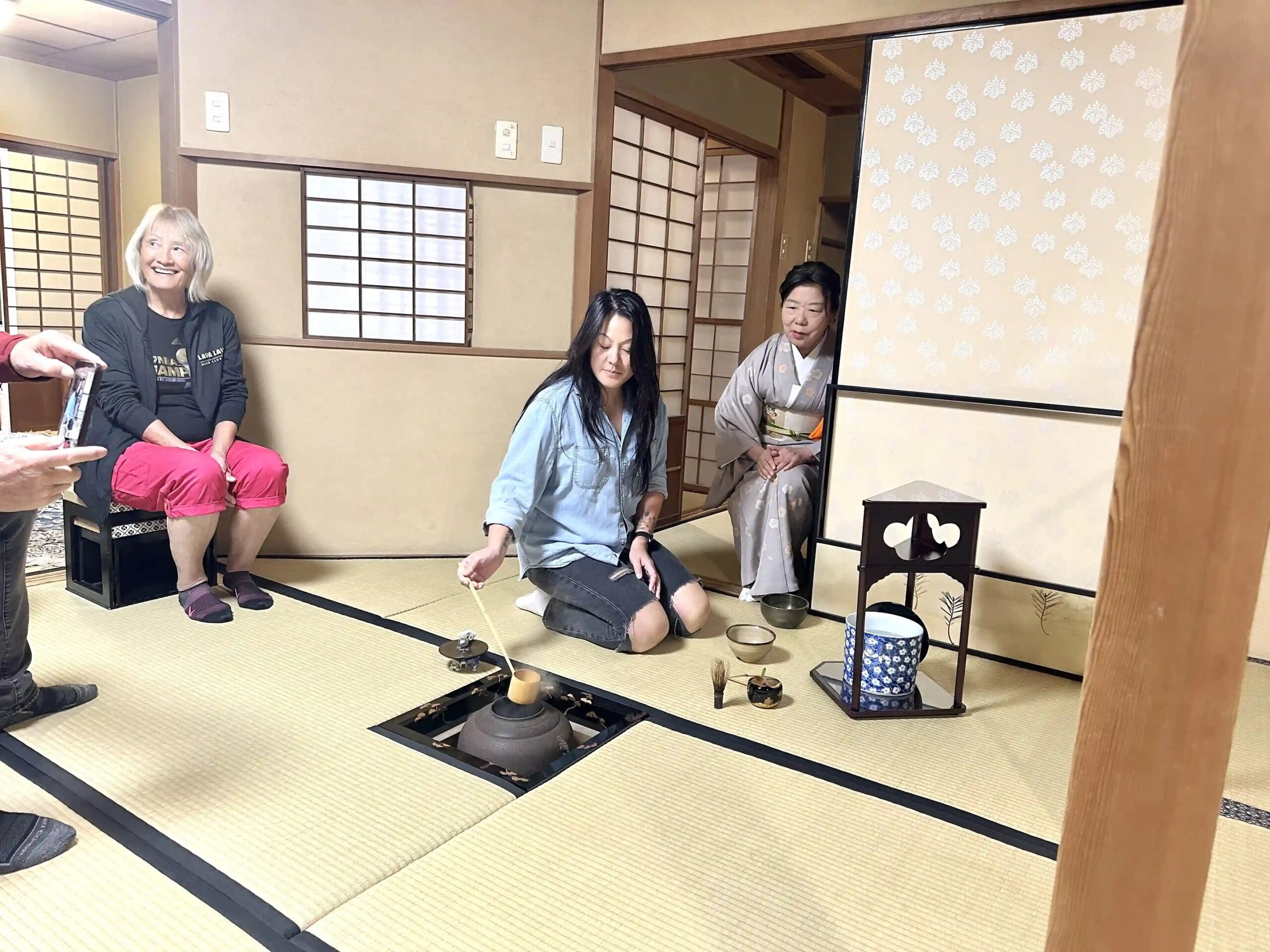 Woman experiencing a traditional tea ceremony in Nagasaki