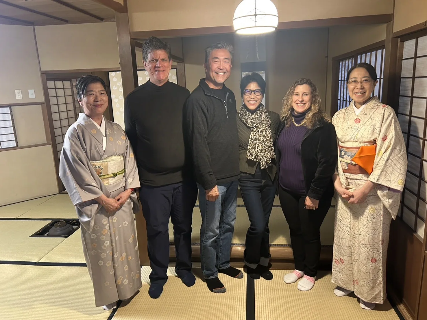 Guests taking a photo with the tea ceremony master in Nagasaki