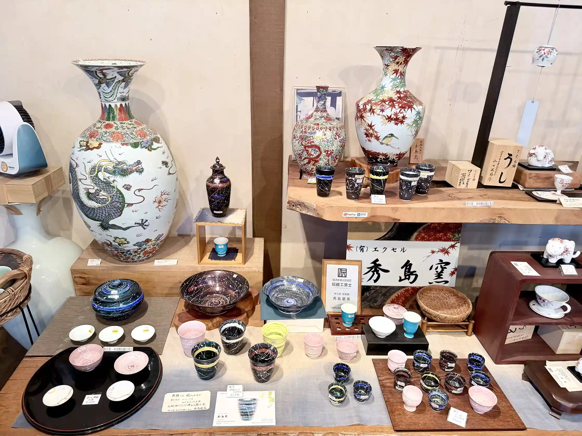 Traditional Arita porcelain with blue and white designs on display