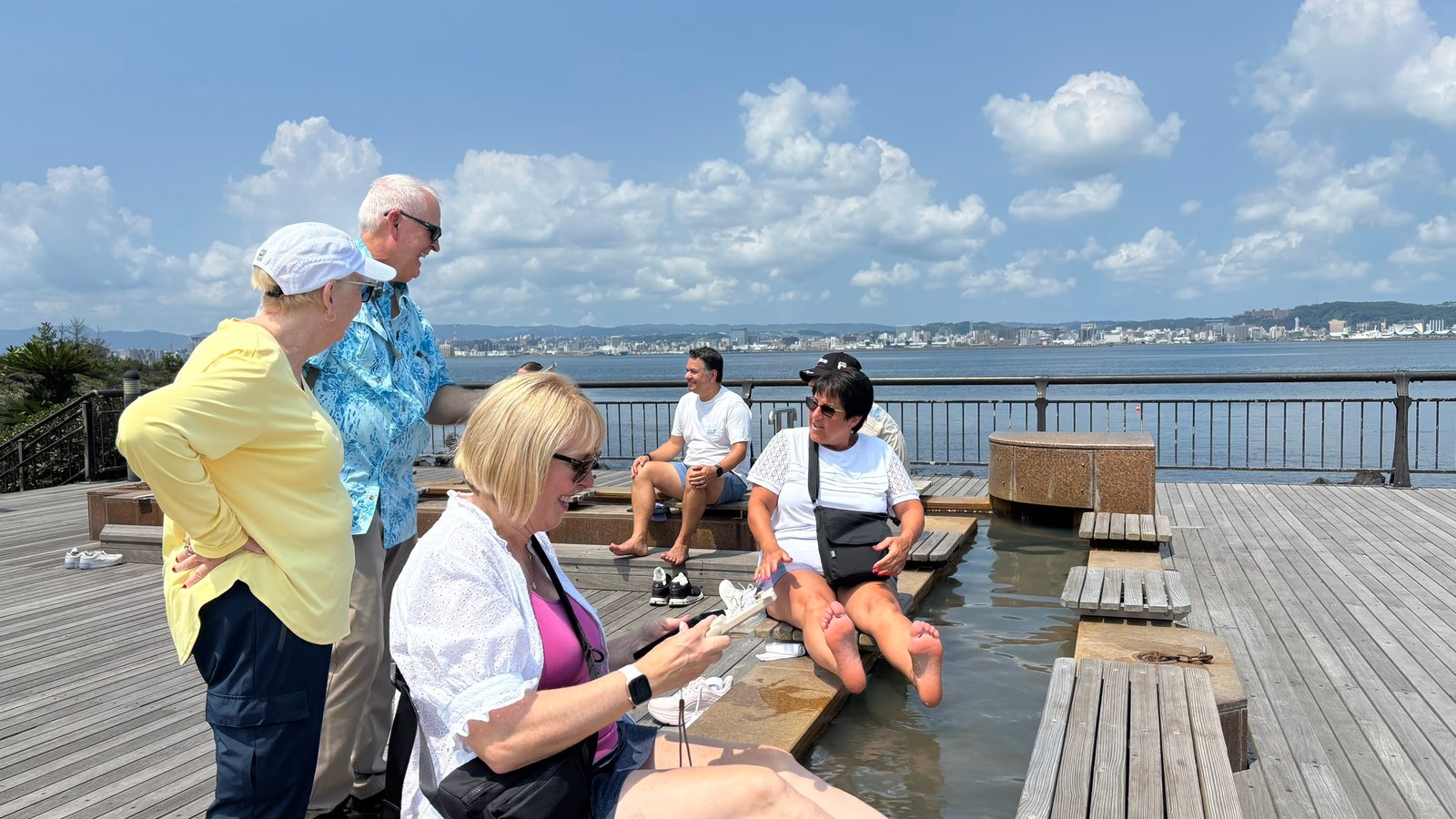 Guests enjoying the foot bath at Sakurajima Yogan Nagisa Park